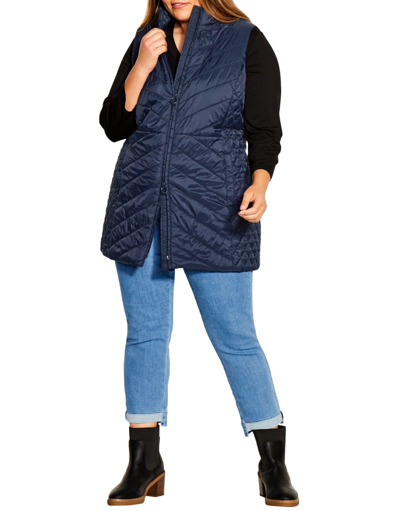 Front of a model wearing a size 14 Lane Quilted Longline Vest in Navy by avenue. | dia_product_style_image_id:234496